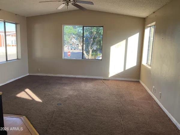 a view of an empty room with a window