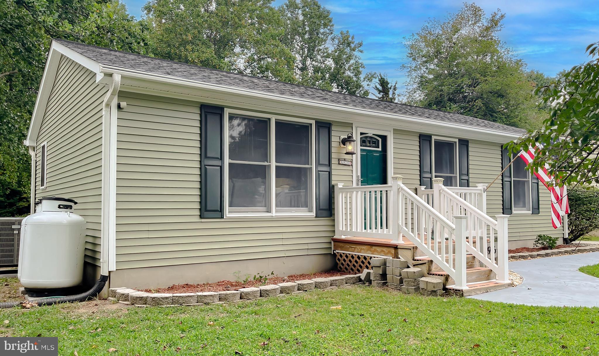 916 Crystal Rock Road Lusby, MD 20657 - Photo 2 of 44 a front view of a house with a yard