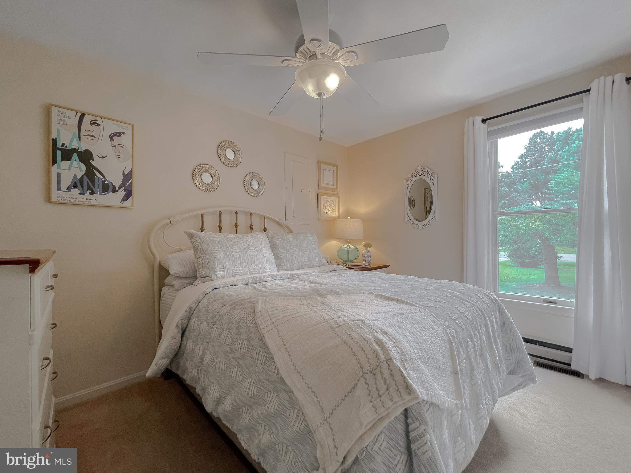 916 Crystal Rock Road Lusby, MD 20657 - Photo 29 of 44 a bedroom with a bed and a large window