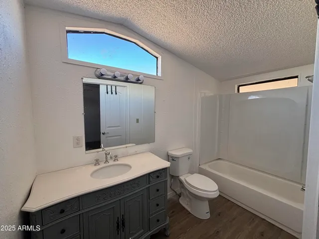 a bathroom with a toilet a sink and a bathtub