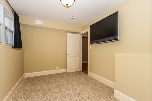 1172 North Old Bridge Road Palatine, IL 60067 - Photo 20 of 27 a view of an empty room with a tv and a window