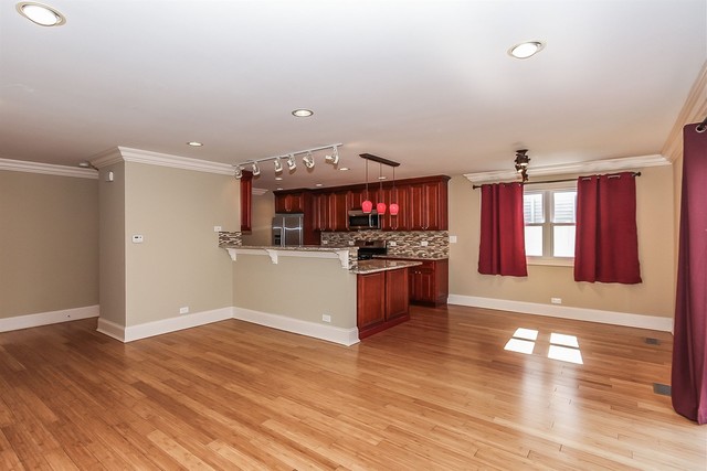 1172 North Old Bridge Road Palatine, IL 60067 - Photo 6 of 27 a kitchen with stainless steel appliances kitchen island granite countertop a stove and a refrigerator