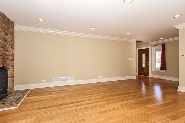 1172 North Old Bridge Road Palatine, IL 60067 - Photo 7 of 27 a view of an empty room with wooden floor and a window