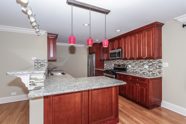 1172 North Old Bridge Road Palatine, IL 60067 - Photo 8 of 27 a kitchen with stainless steel appliances granite countertop a sink stove and refrigerator
