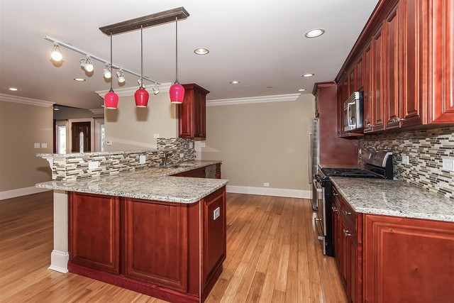 1172 North Old Bridge Road Palatine, IL 60067 - Photo 9 of 27 a kitchen with a sink stove and cabinets