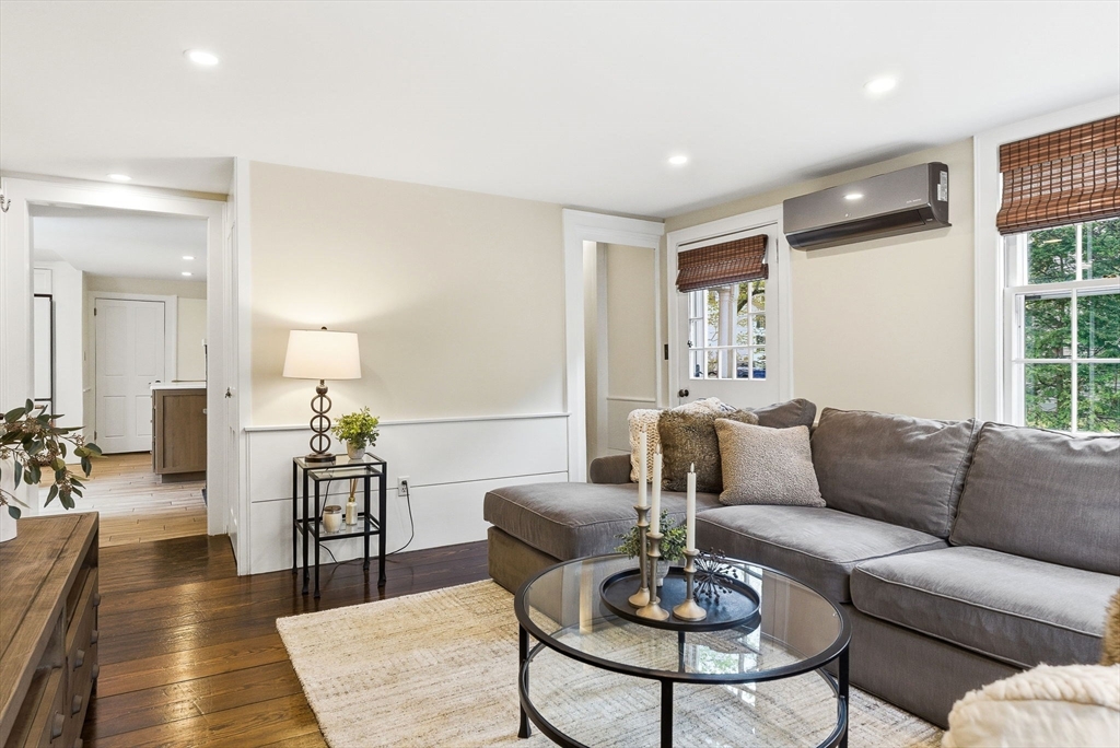 5 Great Road Bedford, MA 01730 - Photo 15 of 42 a living room with furniture and a table