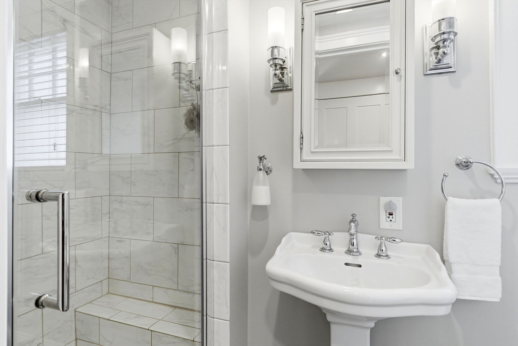 5 Great Road Bedford, MA 01730 - Photo 16 of 42 a bathroom with a sink shower and toilet