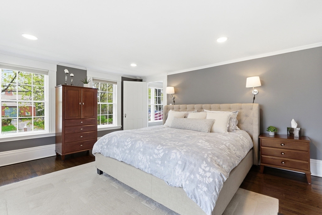 5 Great Road Bedford, MA 01730 - Photo 19 of 42 a bedroom with a bed and wooden floor