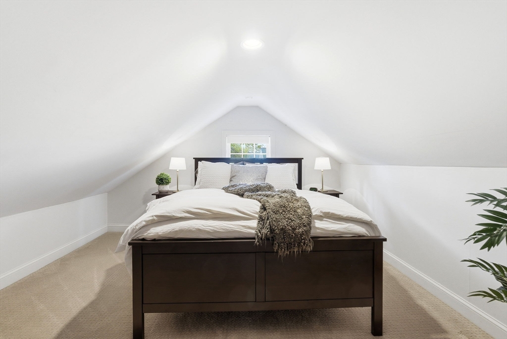 5 Great Road Bedford, MA 01730 - Photo 26 of 42 a bedroom with a bed and a potted plant