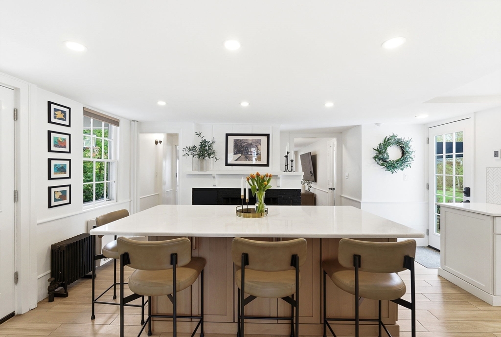 5 Great Road Bedford, MA 01730 - Photo 3 of 42 a view of a dining room with furniture and wooden floor