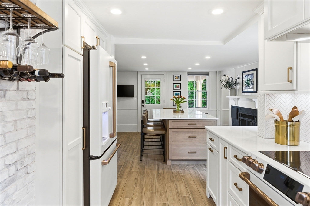 5 Great Road Bedford, MA 01730 - Photo 5 of 42 a kitchen with stainless steel appliances a refrigerator sink and cabinets