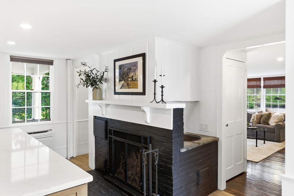 5 Great Road Bedford, MA 01730 - Photo 9 of 42 a living room with furniture and a fireplace