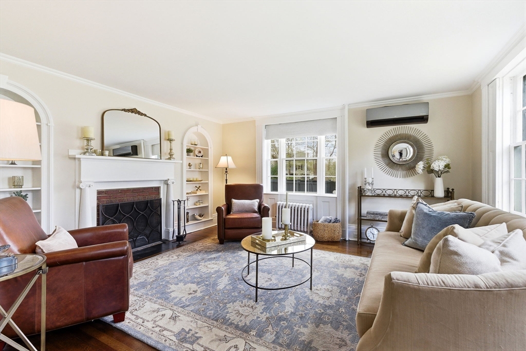5 Great Road Bedford, MA 01730 - Photo 10 of 42 a living room with furniture and a fireplace