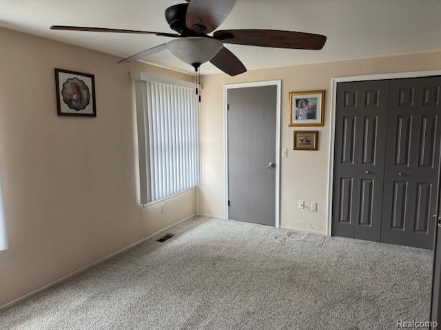 31056 Richert Street, Unit 8 Fraser, MI 48026 - Photo 14 of 19 Bedroom with a ceiling fan, newer carpet, and dual closets