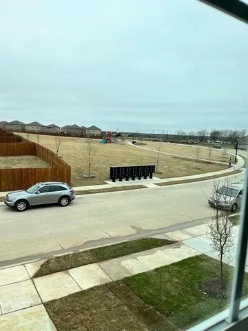 a view of a lake with a lawn chairs