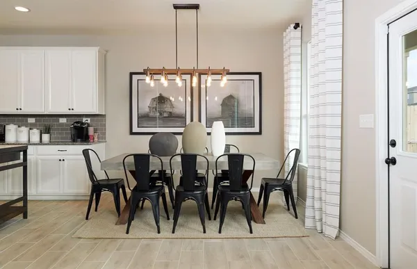 a dining room with furniture and window