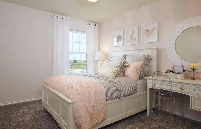 a room with a bed and a table in it