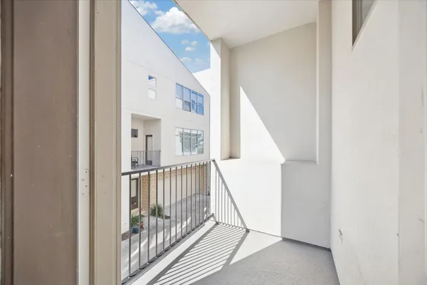 a view of a garden from a corridor