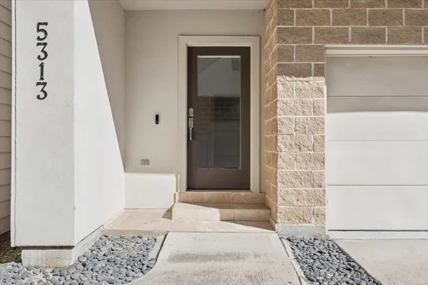 a bathroom with a glass door shower