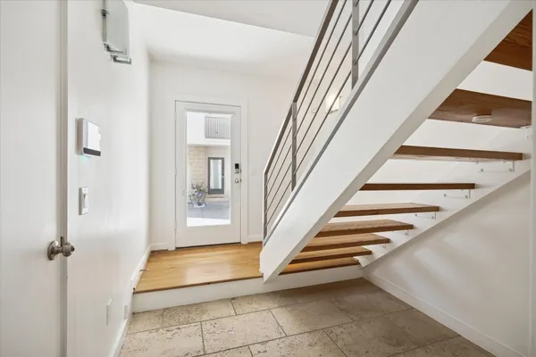 a view of a hallway with staircase