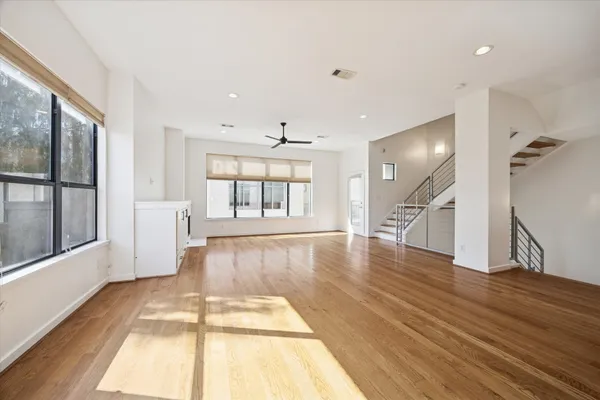 a view of an entryway with wooden floor and windows