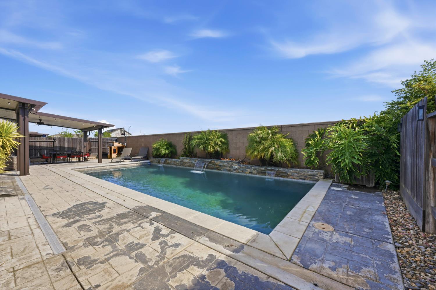 2012 Van Ruiten Drive Lodi, CA 95242 - Photo 42 of 48 a view of a swimming pool with a yard