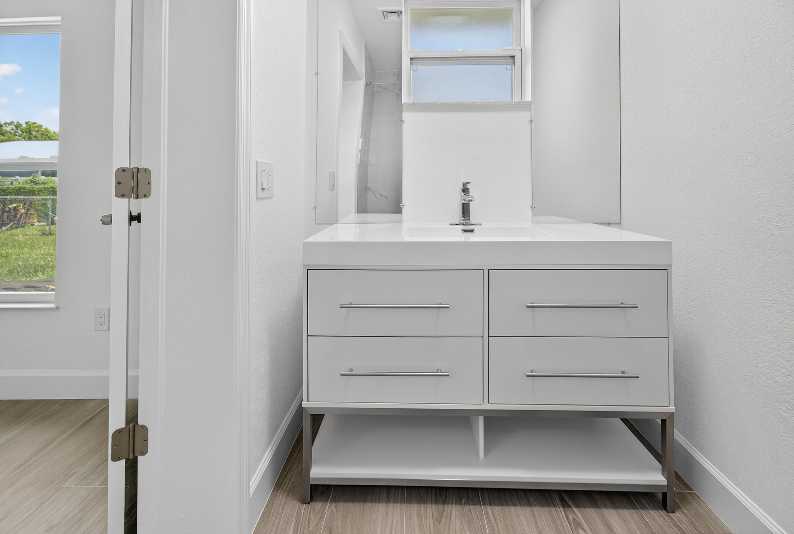 6830 2nd Street Jupiter, FL 33458 - Photo 17 of 34 a bathroom with a sink