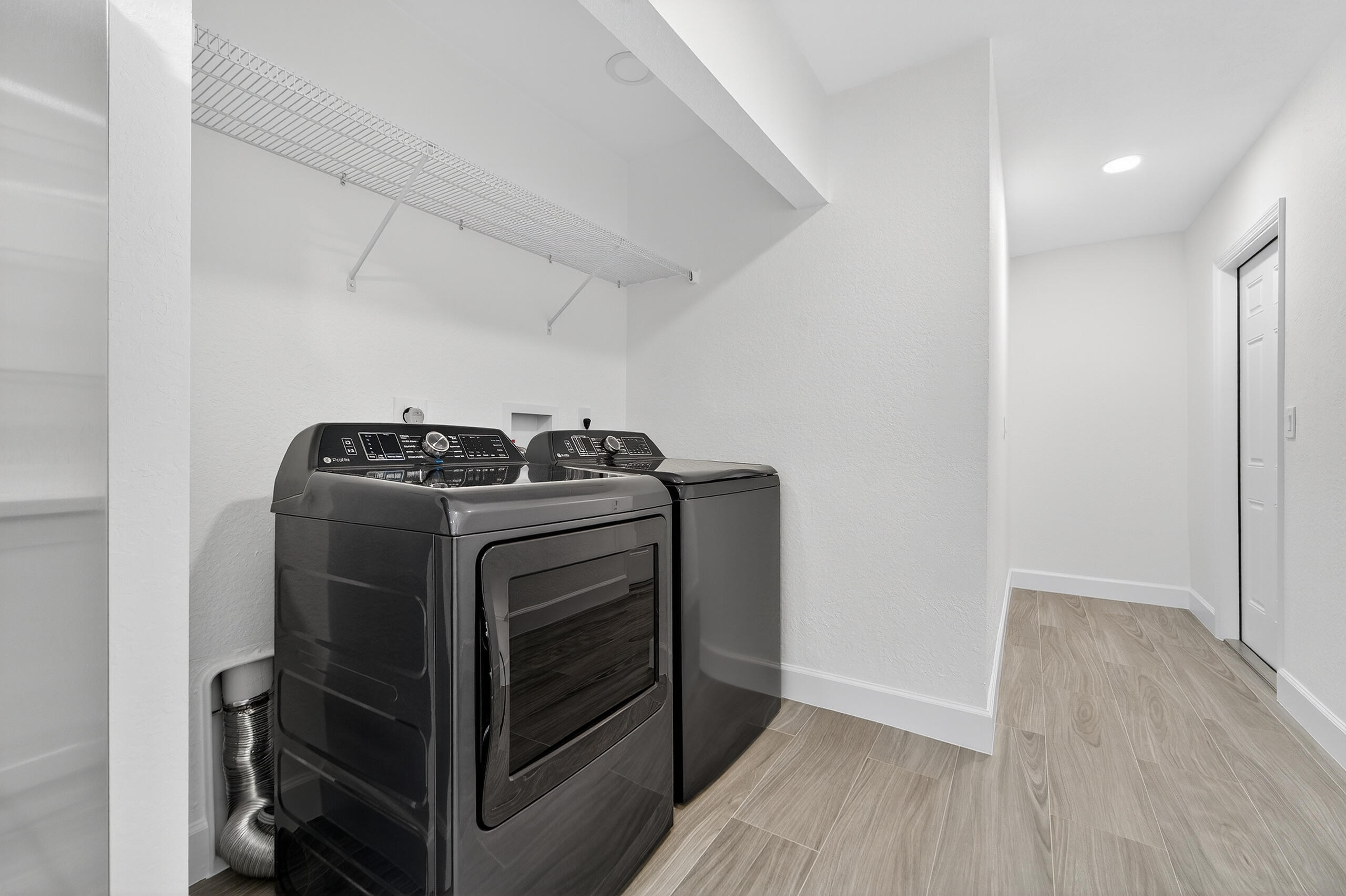 6830 2nd Street Jupiter, FL 33458 - Photo 28 of 34 a view of walk in closet with clothes and shoes