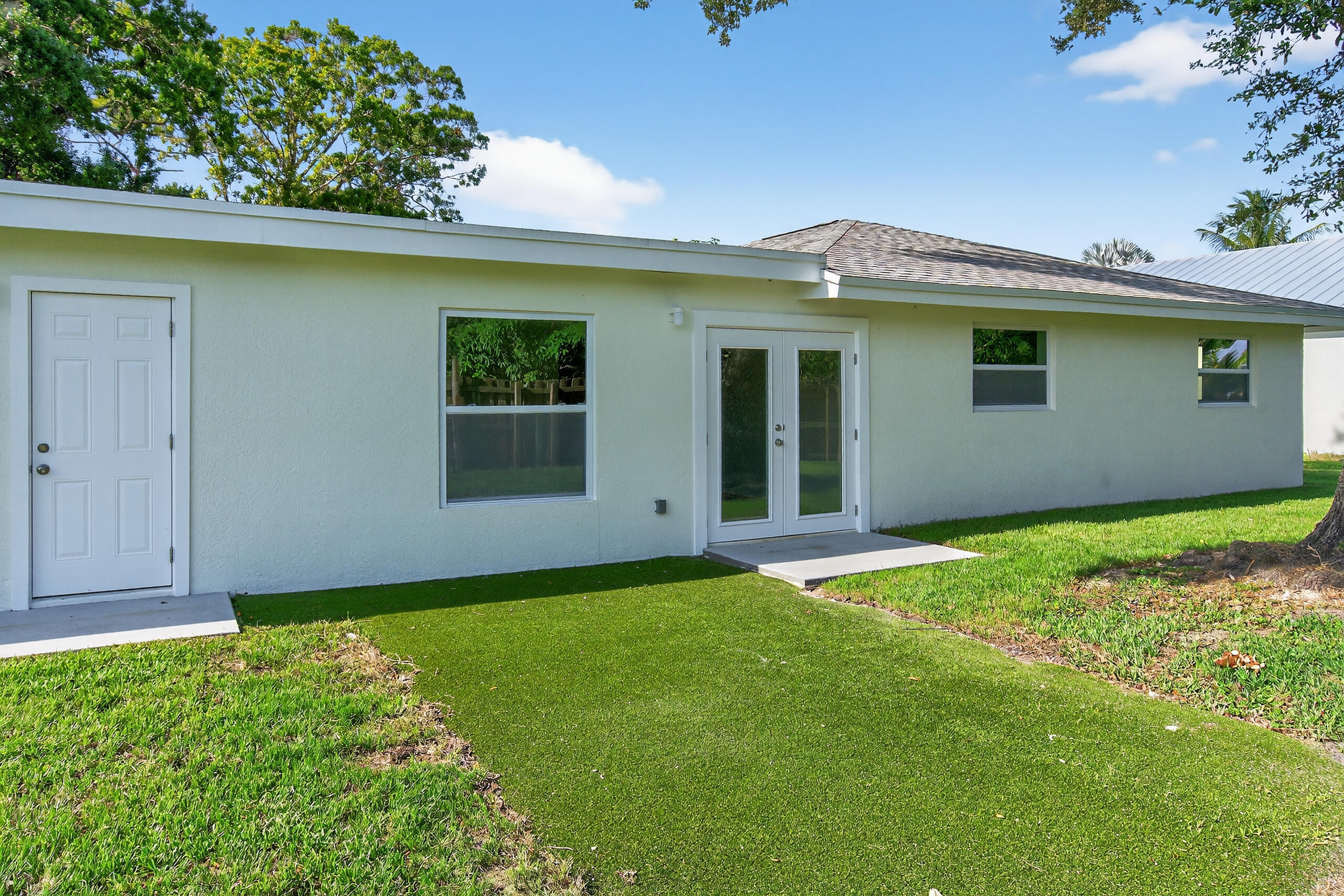6830 2nd Street Jupiter, FL 33458 - Photo 29 of 34 a view of a house with a garden