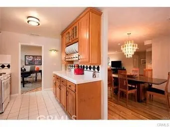 a open kitchen with stainless steel appliances kitchen island granite countertop a sink and cabinets