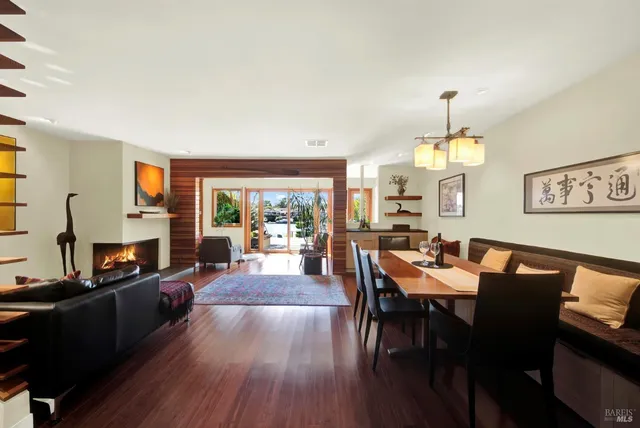 a living room with furniture a rug and a chandelier