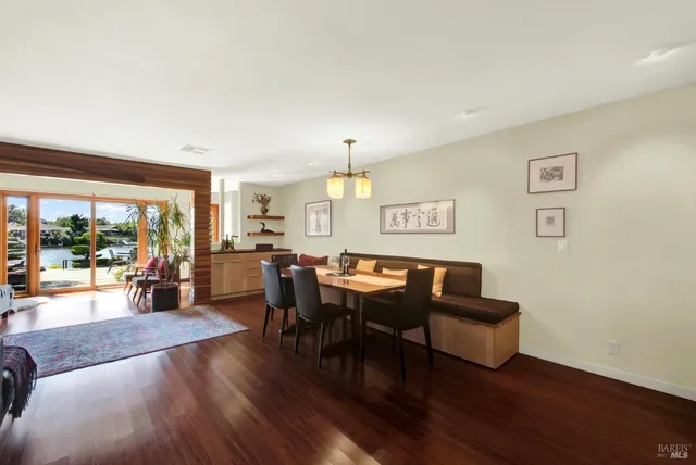 a view of a livingroom with furniture window and wooden floor