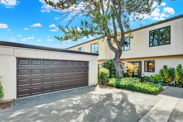 an aerial view of a house with outdoor space and lake view
