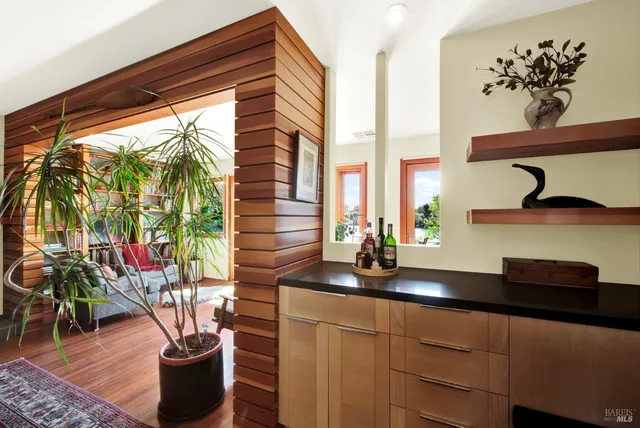 a living room with furniture a rug and a fireplace