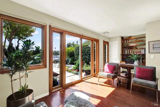 a kitchen with stainless steel appliances granite countertop a sink and a refrigerator