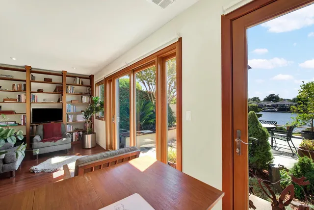 a bathroom with a granite countertop toilet a sink and a mirror