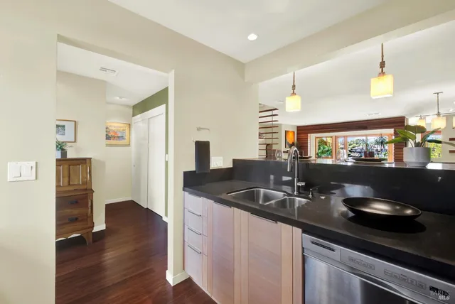 a view of a living room with a floor to ceiling window and floor to ceiling window