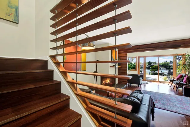 a view of a house with backyard sitting area and garden