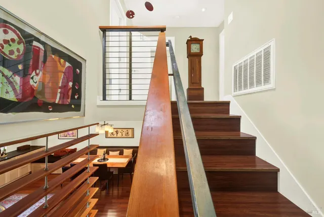a view of a patio with table and chairs and potted plants