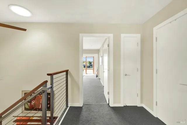 a view of a lake with a table and a chairs