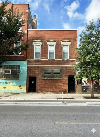 a view of a building with a street