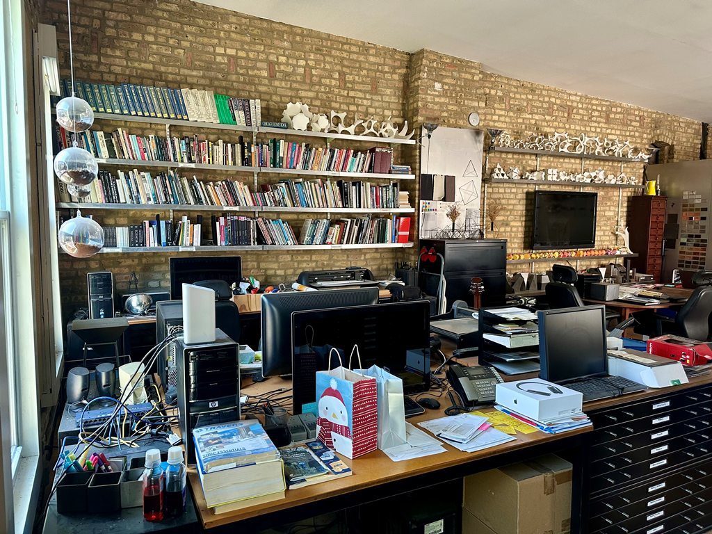 1906 North Milwaukee Avenue Chicago, IL 60647 - Photo 14 of 23 a work room with furniture and a book shelf