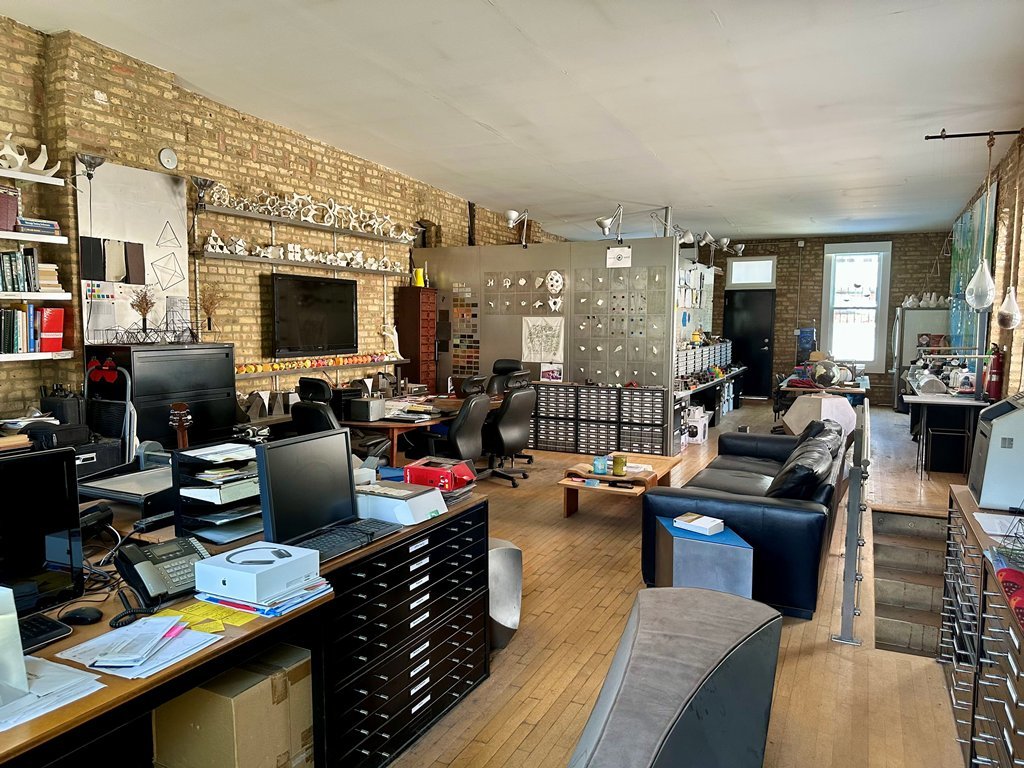 1906 North Milwaukee Avenue Chicago, IL 60647 - Photo 15 of 23 a room with furniture a flat screen tv and a fireplace