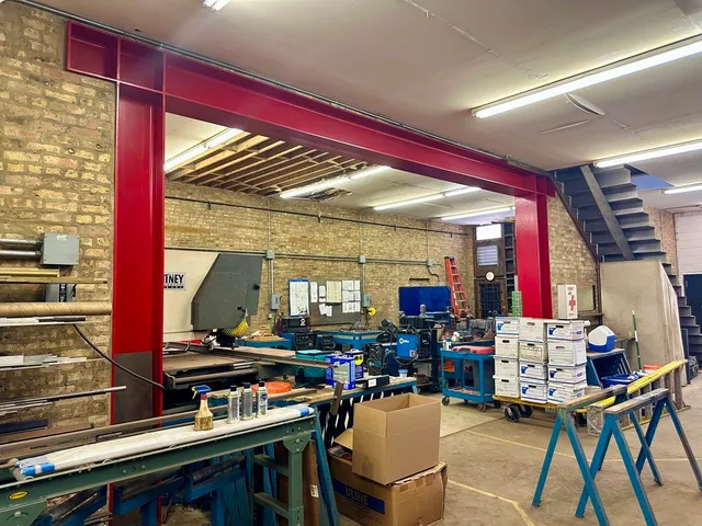 a living room with furniture toys and a large window