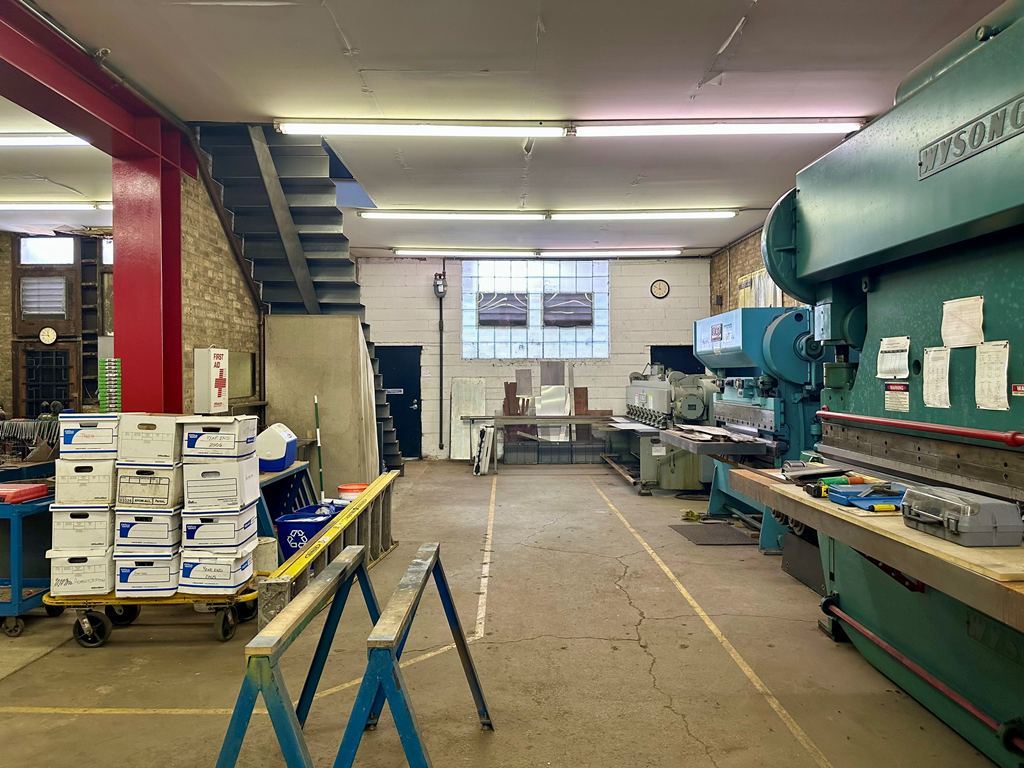 1906 North Milwaukee Avenue Chicago, IL 60647 - Photo 9 of 23 a room with lots of furniture and clutter