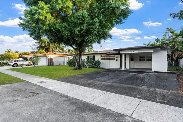 a view of house with outdoor space and tree s