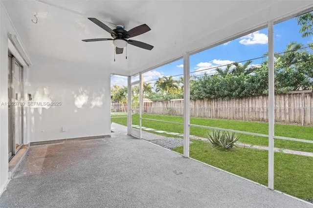 a view of an empty room with floor to ceiling windows and floor to ceiling window
