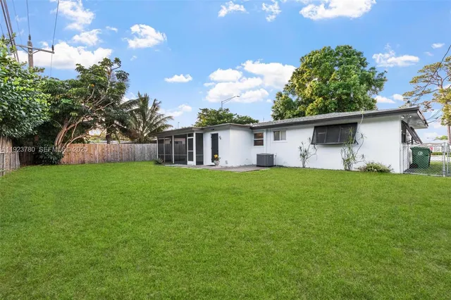 a front view of house with garden