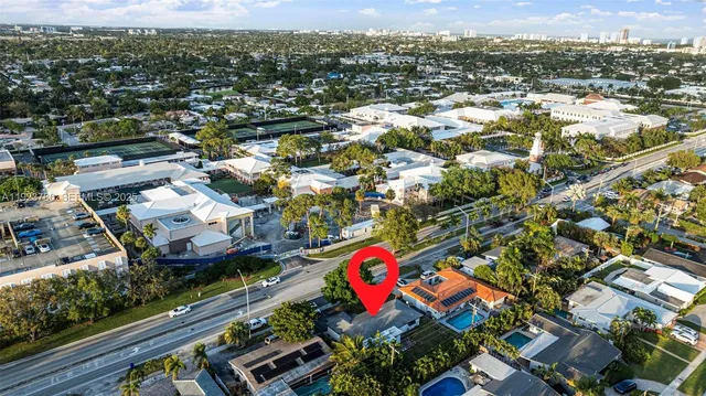 an aerial view of residential houses and city street
