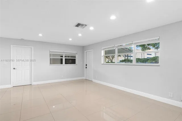 a view of an empty room with a window